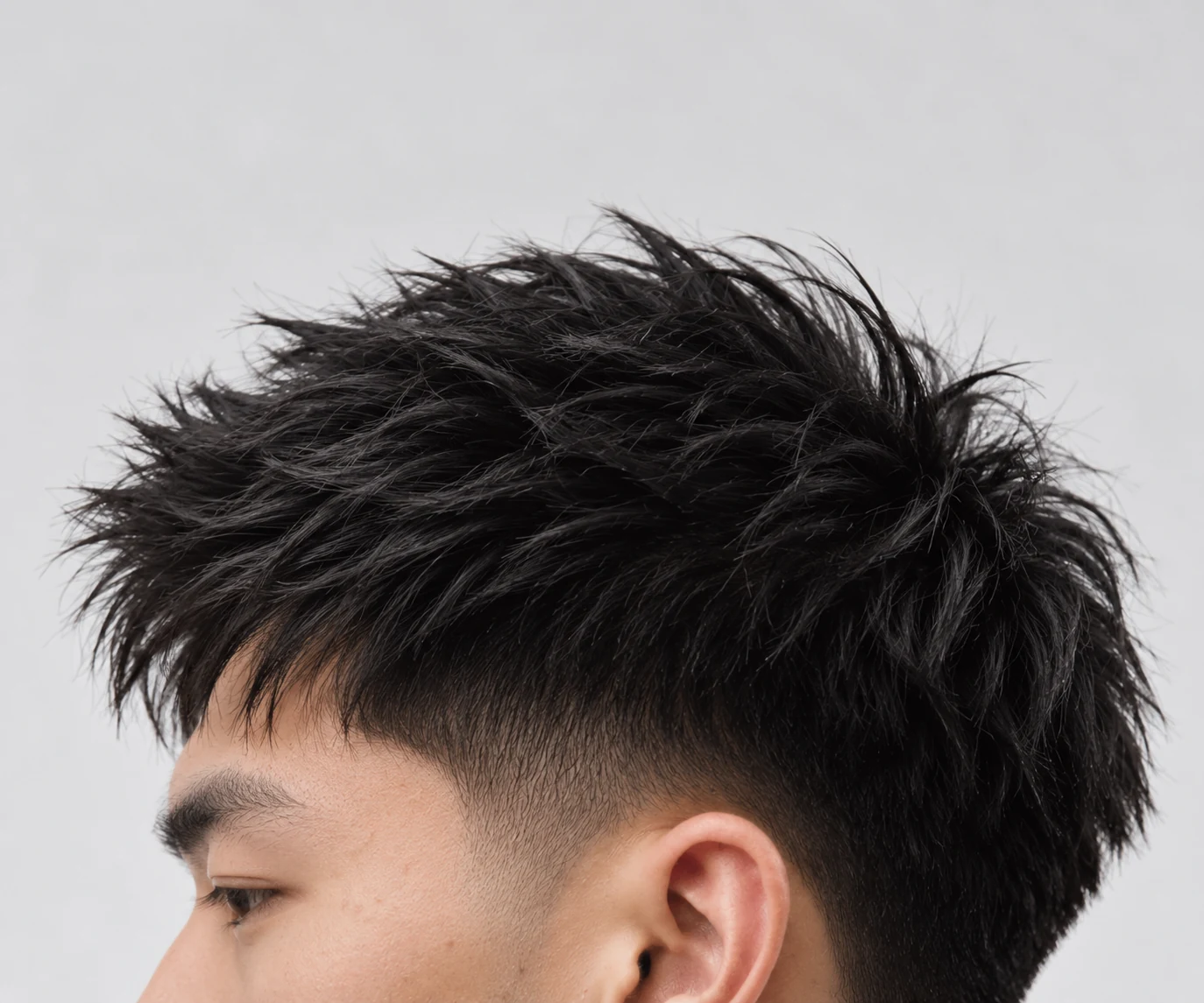 Natural-looking black textured haircut in an editorial studio close-up